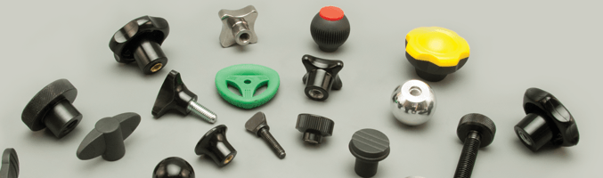 Many different kinds of hand knobs for industrial machines.