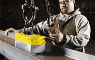 A photo of an industrial worker using Magswitch magnetic lifting tool.